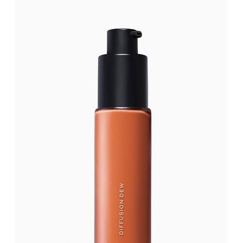 MAKE Beauty Diffusion Dew Skin Tint. Sheer to Medium Coverage Radiant Finish. Blurring, Smoothing, and Brightening for Glowing Complexion. Enhanced with Niacinamide and Adenosine. Bronze 14