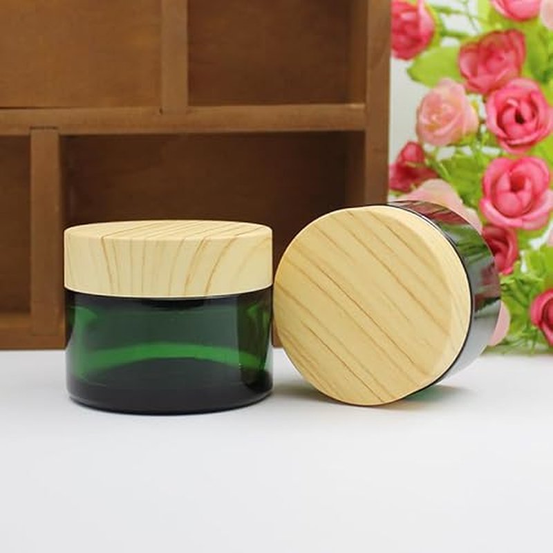 4Pack 50g Green Glass Cosmetic Cream Jars, Empty Sample Jars Containers Pot with Wood Grain Lids for Lotion, Lip Balm, Eye Cream, Scrubs, Oils, Salves, Ointments